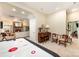 Spacious recreation room featuring an air hockey table, sitting area, and stairway at 408 Johnsfield Rd, Shelby, NC 28150