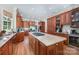 Gourmet kitchen boasts granite countertops, large center island, and custom cabinetry at 408 Johnsfield Rd, Shelby, NC 28150