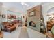Inviting living room with a cozy fireplace, comfortable seating, and seamless flow into the dining area at 408 Johnsfield Rd, Shelby, NC 28150