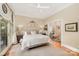 Spacious main bedroom features a king bed, large windows, and a sitting room through the doorway at 408 Johnsfield Rd, Shelby, NC 28150