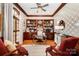 Bright office with a desk, decorative wallpaper, bookcase, and comfortable seating at 408 Johnsfield Rd, Shelby, NC 28150