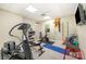Home gym featuring workout equipment, bright lighting, and a neutral color scheme at 408 Johnsfield Rd, Shelby, NC 28150