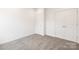 This bedroom has neutral gray carpet and white walls with a double door closet at 4226 Acorn St, Charlotte, NC 28205