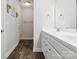 Bathroom features wood floor and double sink vanity with white cabinets at 429 Summer Ridge Dr, Stanley, NC 28164