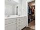 Bright bathroom with double sink vanity, white cabinets and a walk-in closet at 429 Summer Ridge Dr, Stanley, NC 28164