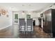 Bright kitchen featuring white cabinets, stainless steel appliances and hardwood floors at 429 Summer Ridge Dr, Stanley, NC 28164