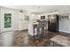 Kitchen with modern appliances, white cabinetry and an island at 429 Summer Ridge Dr, Stanley, NC 28164