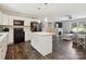 Bright kitchen featuring an island with seating that opens up to the living room at 429 Summer Ridge Dr, Stanley, NC 28164
