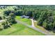 Charming single-story home with a white picket fence and lush green surroundings at 4395 Burton Rd, Maiden, NC 28650