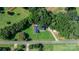Beautiful home with a well-maintained lawn and surrounded by lush trees at 4395 Burton Rd, Maiden, NC 28650
