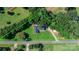 Aerial view of property featuring lush greenery, a house, and a surrounding perimeter at 4395 Burton Rd, Maiden, NC 28650