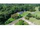Scenic view of a home surrounded by greenery, complete with a fenced yard at 4395 Burton Rd, Maiden, NC 28650