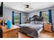 Serene bedroom featuring wood furniture, natural lighting, and a tranquil atmosphere for relaxation at 4395 Burton Rd, Maiden, NC 28650