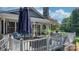 A white-railed deck features patio seating, ideal for entertaining or relaxing at 4395 Burton Rd, Maiden, NC 28650