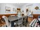 Rustic dining room features hardwood floors, decorative wall hangings, and seating for six at 4395 Burton Rd, Maiden, NC 28650