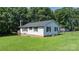 This ranch features a bay window and partial basement, with ample outdoor green space at 4395 Burton Rd, Maiden, NC 28650