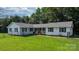 Well maintained ranch home, complete with a covered front porch, landscaping and yard at 4395 Burton Rd, Maiden, NC 28650