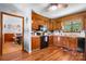Efficient kitchen featuring warm wood cabinetry, natural light, and practical layout at 4395 Burton Rd, Maiden, NC 28650