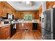 Spacious kitchen with wood cabinets, stainless steel appliances, and ample counter space for cooking at 4395 Burton Rd, Maiden, NC 28650