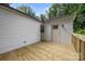 A view of the back deck on the home with a wooden floor and white siding at 442 Lovelace Rd, Rock Hill, SC 29730