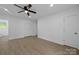 Spacious bedroom with wood-look floors, ceiling fan, and closet at 442 Lovelace Rd, Rock Hill, SC 29730