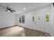 Bright bedroom boasts neutral walls, wood-look floors, and a large window plus an exterior door for ample natural light at 442 Lovelace Rd, Rock Hill, SC 29730
