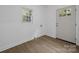 Functional mud room with a window for natural light, an exterior door, and wood-look flooring at 442 Lovelace Rd, Rock Hill, SC 29730