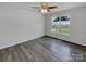 Clean bedroom with a window providing natural light and dark woodgrain flooring at 4550 Briarcreek Rd, Maiden, NC 28650