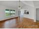 Bright living room features hardwood floors and ample natural light from large windows at 4550 Briarcreek Rd, Maiden, NC 28650
