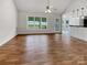 Bright open-concept living room with hardwood floors and large window, perfect for entertaining at 4550 Briarcreek Rd, Maiden, NC 28650