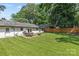 The backyard is spacious with a patio, outdoor furniture and a lush lawn at 5329 Valley Forge Rd, Charlotte, NC 28210