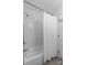 Bathroom featuring white tile and a bathtub at 5329 Valley Forge Rd, Charlotte, NC 28210