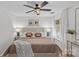 Bright bedroom featuring a queen bed, lamps, an accent rug, and natural light from the window at 5329 Valley Forge Rd, Charlotte, NC 28210