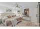 Bedroom with a queen bed, nightstands, lamps, an accent rug, and natural light from the window at 5329 Valley Forge Rd, Charlotte, NC 28210