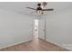 Bedroom featuring light walls, hard wood floors and door at 5329 Valley Forge Rd, Charlotte, NC 28210