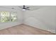 Bright and spacious bedroom with a ceiling fan and natural light from the window at 5329 Valley Forge Rd, Charlotte, NC 28210
