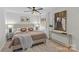 Bedroom featuring a queen bed, lamps, an accent rug, and abstract art on the wall at 5329 Valley Forge Rd, Charlotte, NC 28210