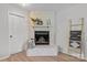 Bright living room with stone fireplace, neutral colors, and ladder at 5329 Valley Forge Rd, Charlotte, NC 28210