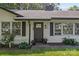 Charming home with an inviting front door, black shutters, and well-maintained landscaping at 5329 Valley Forge Rd, Charlotte, NC 28210