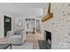 Hallway with wood floors and a fireplace at 5329 Valley Forge Rd, Charlotte, NC 28210
