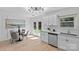 Charming kitchen with white cabinets, modern appliances, and a view to the backyard at 5329 Valley Forge Rd, Charlotte, NC 28210
