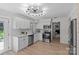 Bright kitchen with subway tile backsplash, stainless steel appliances, and hardwood floors at 5329 Valley Forge Rd, Charlotte, NC 28210
