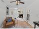 Bright living room with hardwood floors, stylish decor, and a stone fireplace at 5329 Valley Forge Rd, Charlotte, NC 28210