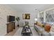 Bright living room with a cozy fireplace, soft lighting, and modern furnishings at 5329 Valley Forge Rd, Charlotte, NC 28210