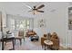 Living room featuring light walls, hard wood floors and neutral furniture at 5329 Valley Forge Rd, Charlotte, NC 28210