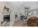 Inviting living room with stone fireplace, neutral colors, and lots of natural light at 5329 Valley Forge Rd, Charlotte, NC 28210