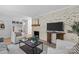Well-decorated living room with a stylish fireplace, open shelving, and comfortable seating arrangement at 5329 Valley Forge Rd, Charlotte, NC 28210
