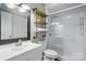 Bathroom featuring a modern shower, shelves, and bright lighting at 656 Ne Camrose Ne Cir, Concord, NC 28025