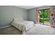 Bright bedroom with large bed and sliding glass doors to the outside at 656 Ne Camrose Ne Cir, Concord, NC 28025