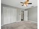 Spacious bedroom featuring a fan, closet, and neutral colored walls at 656 Ne Camrose Ne Cir, Concord, NC 28025